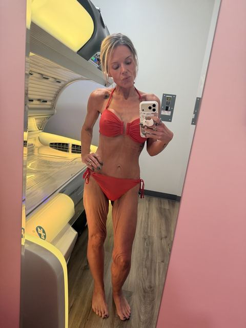 Roxxxy in an orange bikini